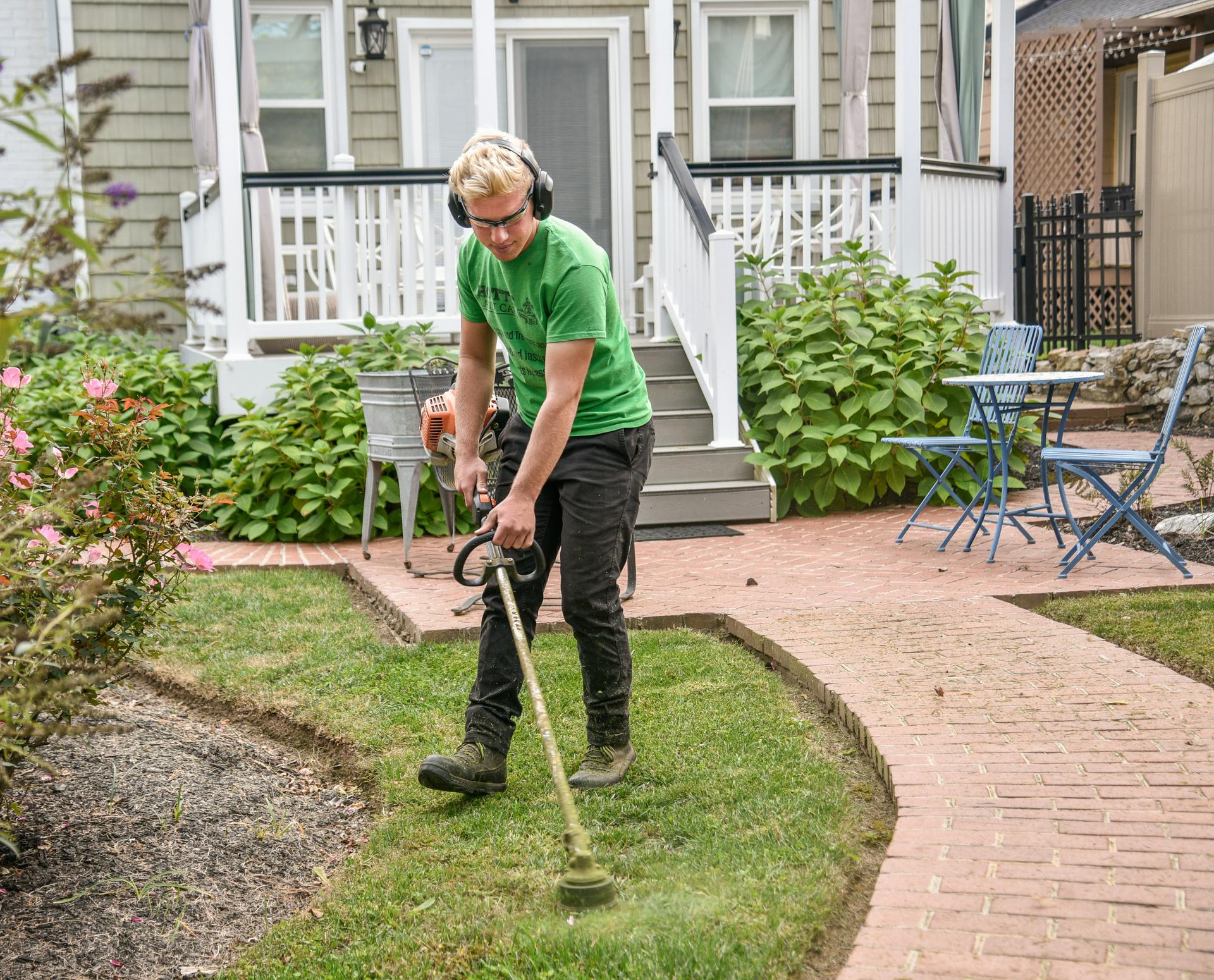 Luxury Lawns team members working on a beautiful lawn